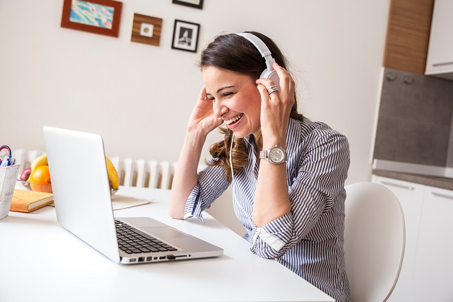 Woman working remotely talking to the rest of her team- Hays Viewpoint, careers advice blog