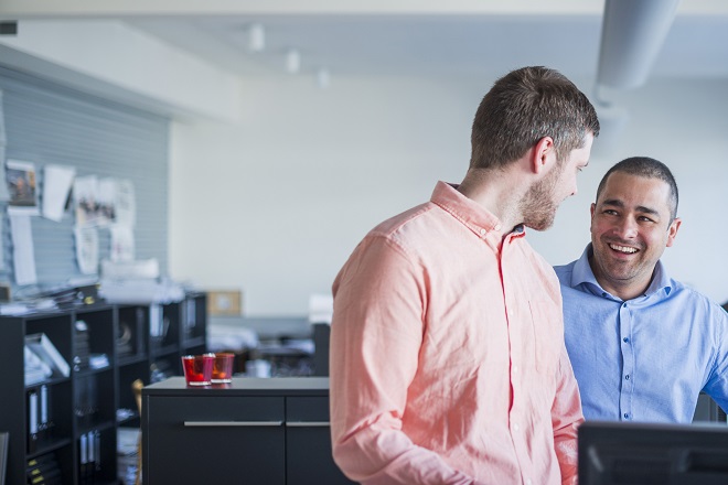 Newly promoted manager talking to colleague -Hays careers advice