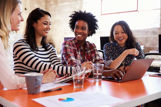 Female IT professionals having a discussion- Hays careers advice