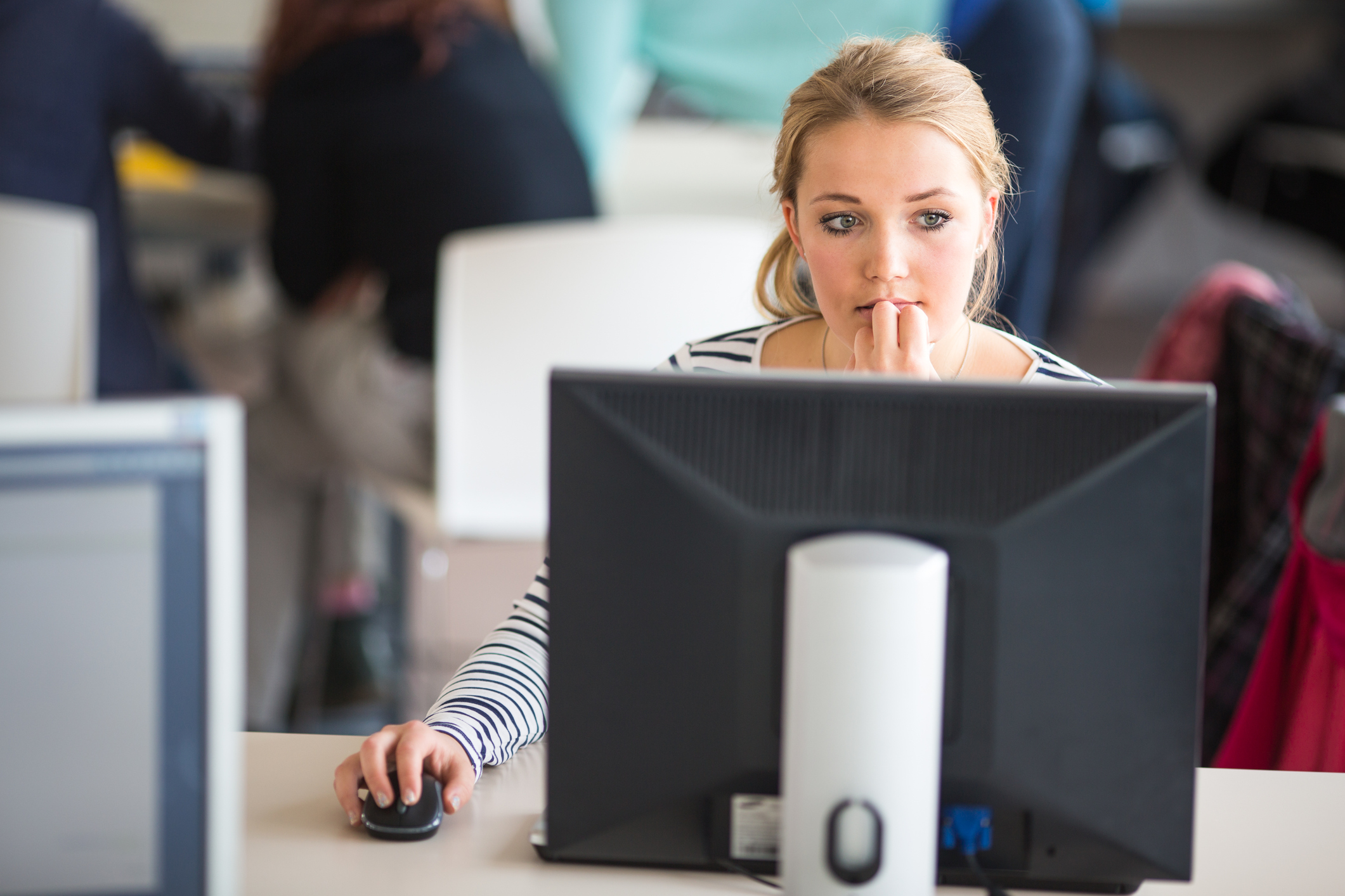 Employee at desk look at meeting request- Hays careers advice