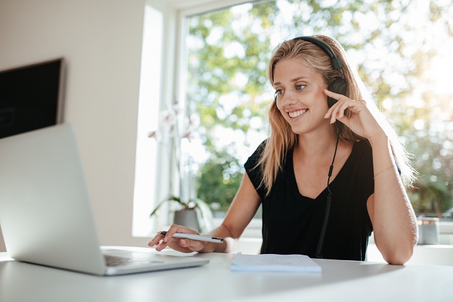 Woman listening to a podcast about job search